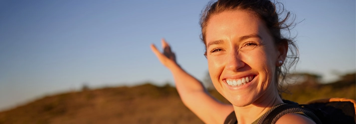 Chiropractic Ocoee FL Happy Woman A smiling woman outside.