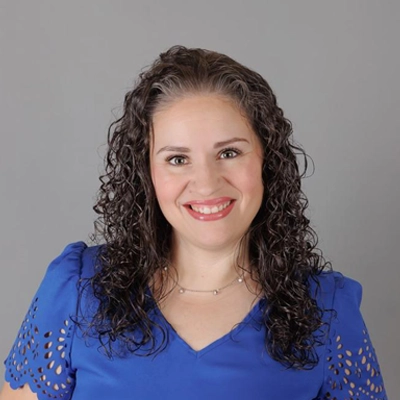 Dr. Nicole Palmer, she has curly hair.